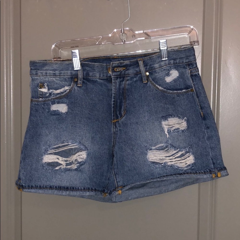 Ripped blue jean shorts